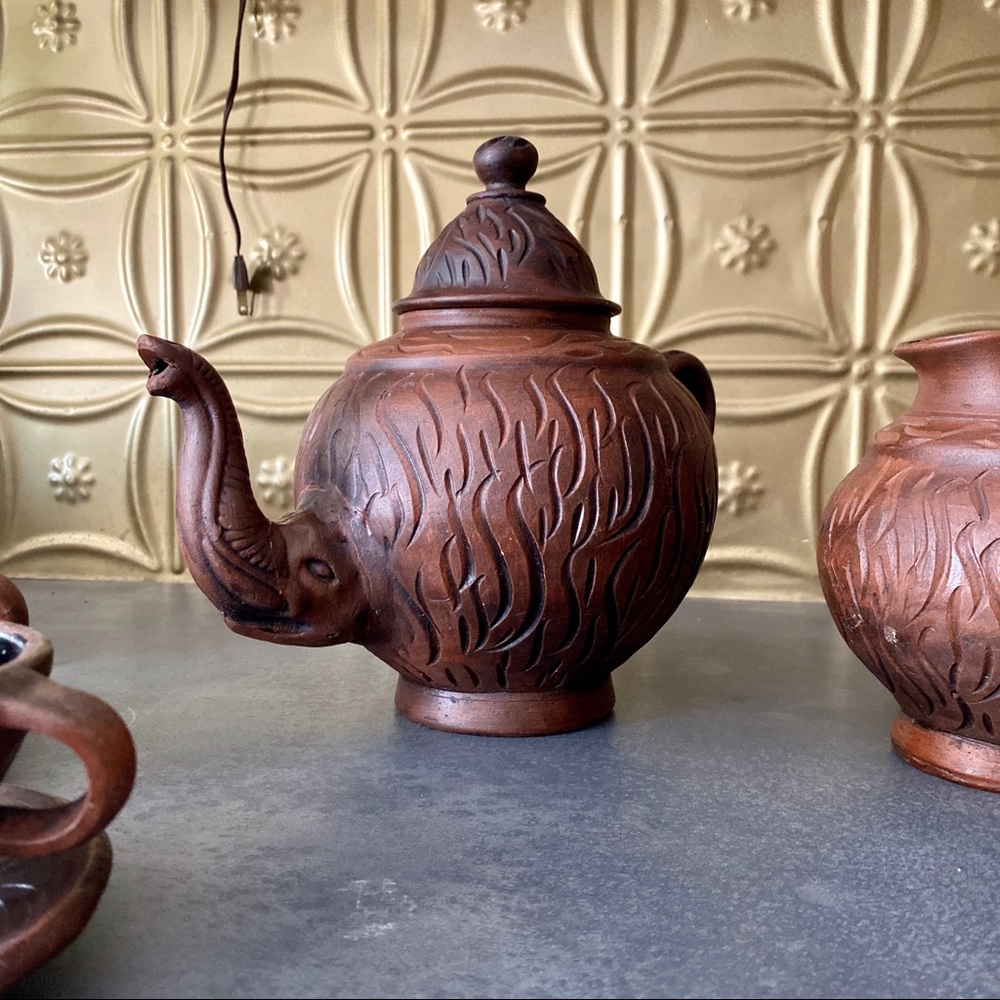 decorative “wood” carved ceramic African tea set